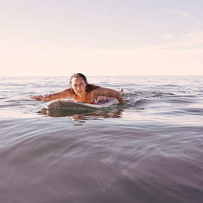 Buy stock photo Surfing, woman and portrait in waves, sea and ocean for summer adventure, freedom and sky mockup in Australia. Female surfer, board and swimming in water, beach and relax for tropical holiday travel