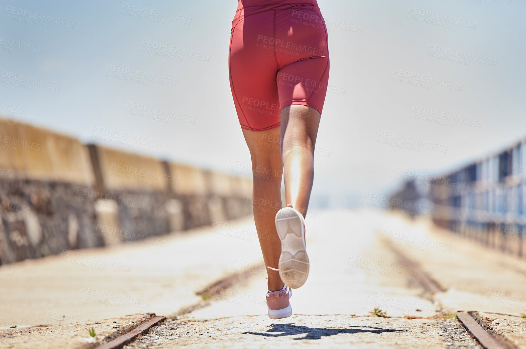 Buy stock photo Legs, running and fitness with runner outdoor, black woman athlete with cardio, speed and sneakers with run on bridge. Runner, active and sports with workout, exercise back view and mockup space