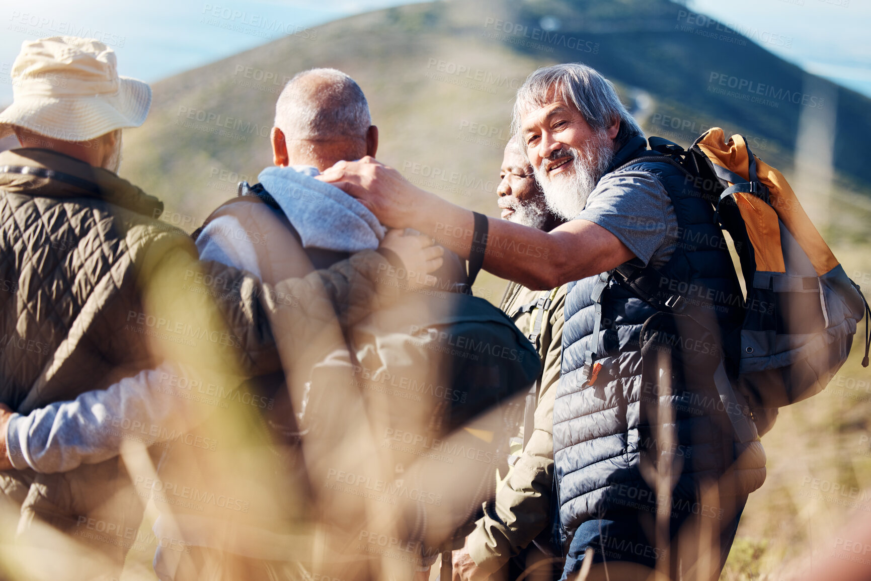 Buy stock photo Senior hiking, mountain and elderly friends in nature on a walk with freedom and hug in retirement. Healthy exercise, trekking and and outdoor travel adventure of old men group together for walk