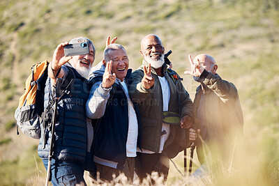 Buy stock photo Senior hiking, mountain selfie and elderly friends in nature on a walk with freedom in retirement. Healthy exercise, trekking and and outdoor adventure of old men group together with peace sign