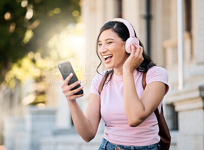 Buy stock photo Music, headphones or video call by woman in city for travel, happy and smile on building background. Radio, podcast and travelling girl student with app, online audio or subscription service outside