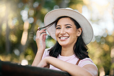 Buy stock photo Woman, park and portrait of a female traveler on a garden bench with a smile from travel. Freedom, happiness and hair twirl of a Asian person on holiday feeling happy on vacation enjoying nature