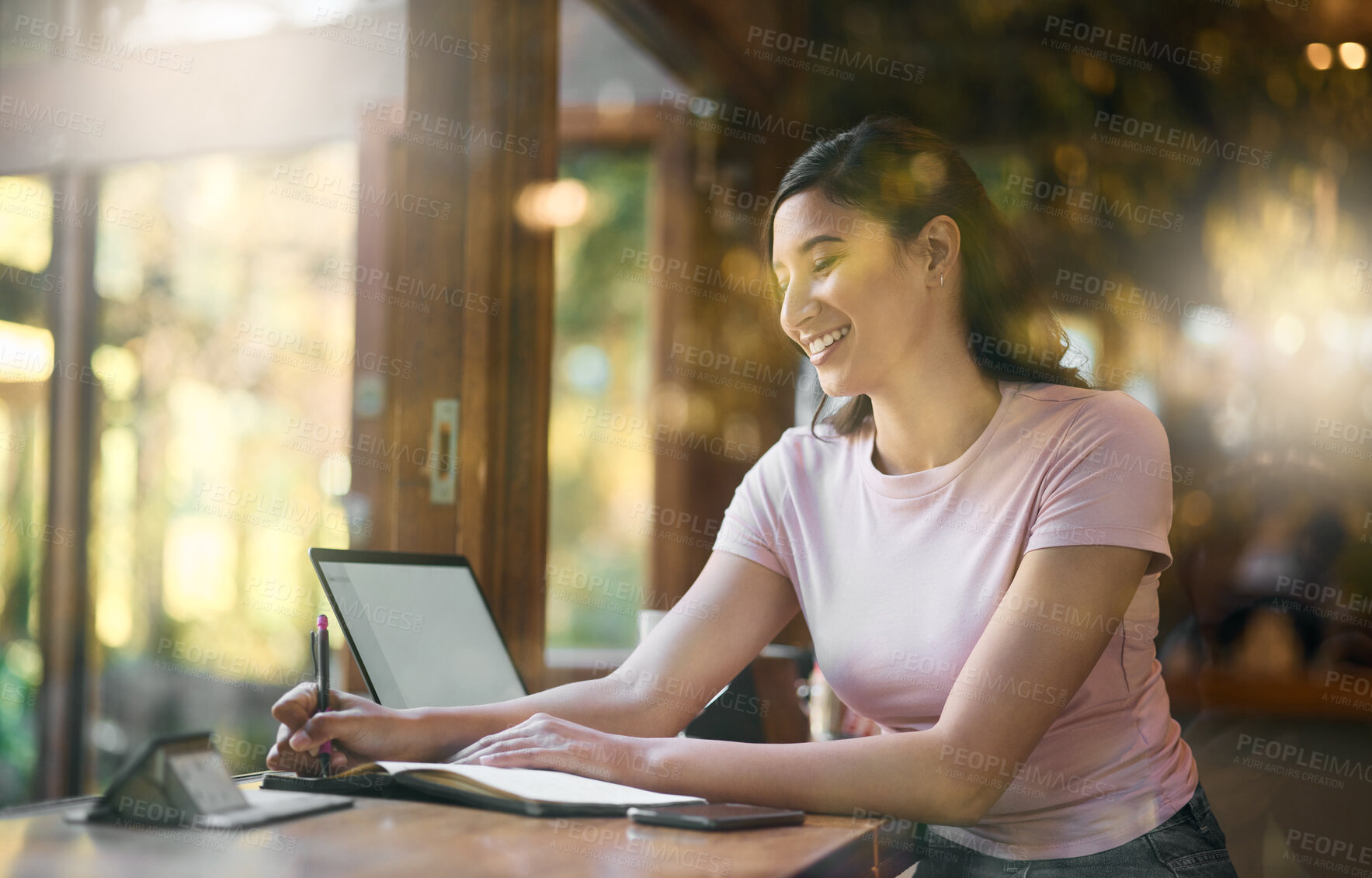 Buy stock photo Smile, remote work or woman writing in cafe, laptop or planning research, creative idea or schedule. Happy, startup or employee girl in coffee shop with notebook and tech for social network blog news