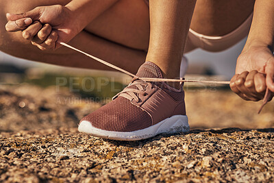 Buy stock photo Fitness, hands and tie shoes in nature to start running, workout or training. Sports, wellness and female or woman tying sneaker laces or footwear to get ready for exercising, cardio or jog outdoors.
