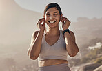 Portrait, fitness and music for woman in nature for running, training and cardio on blurred background. Happy, face and radio for girl outdoor for exercise, wellness and motivation with podcast track