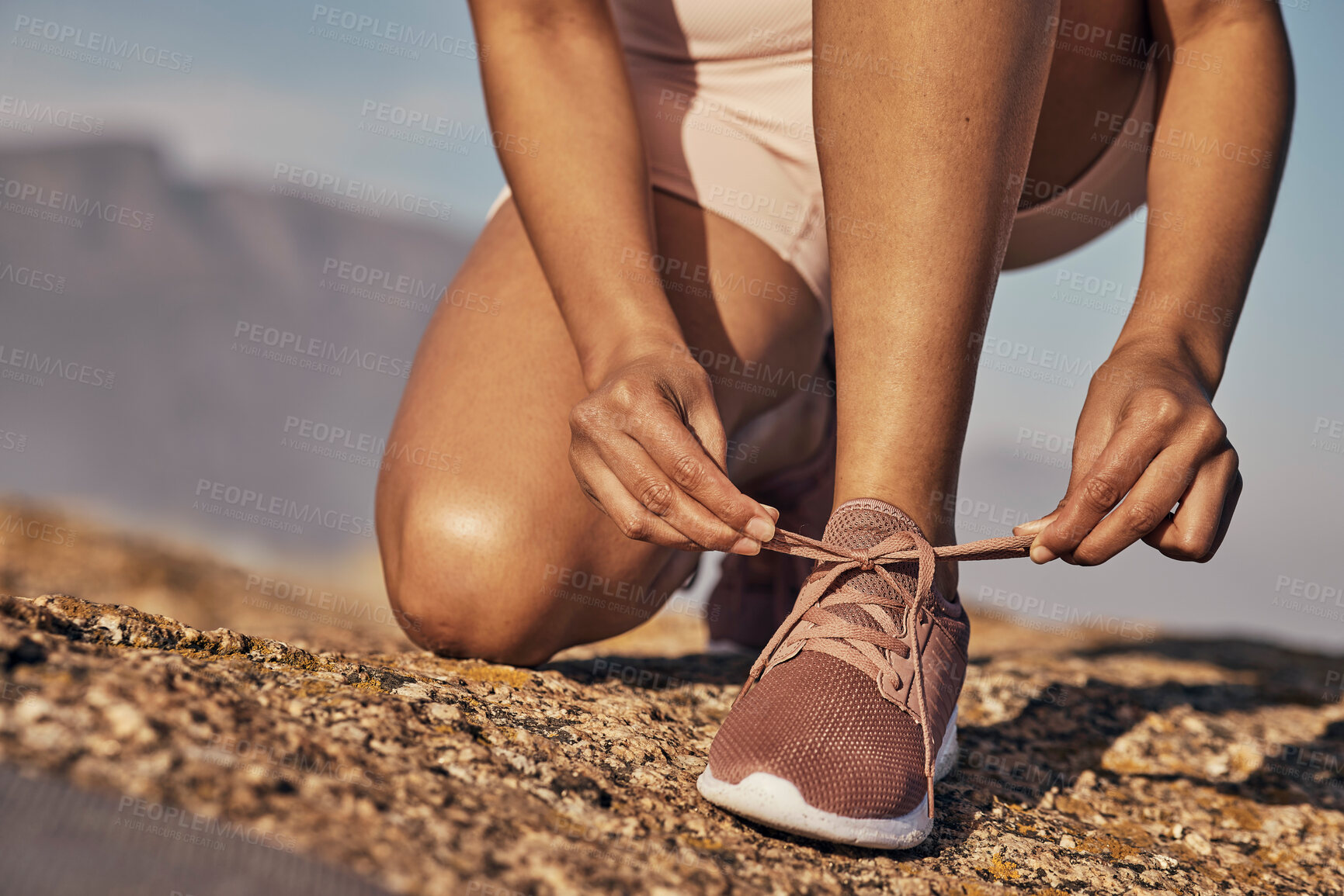 Buy stock photo Hands, hiking and tie shoes in nature to start running, workout or training. Sports, wellness and female or woman tying sneaker laces or footwear to get ready for exercising, cardio or hike outdoors.