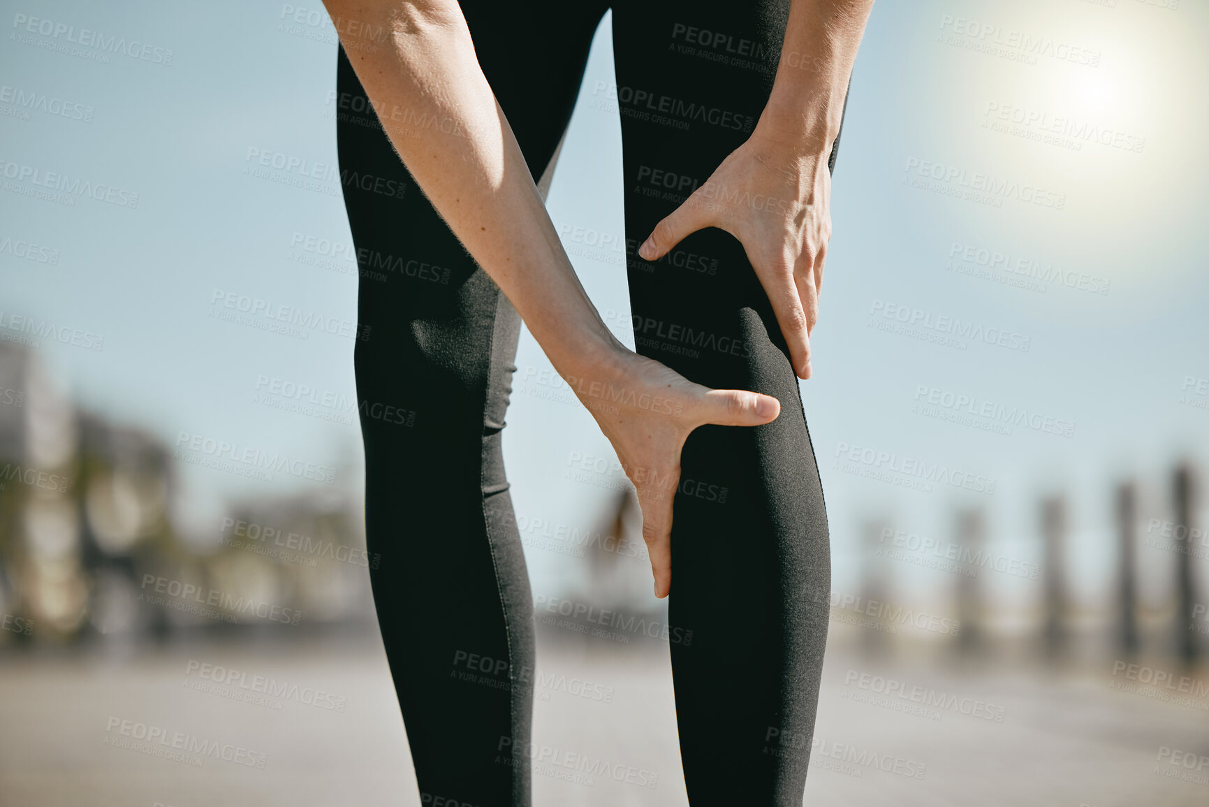 Buy stock photo Fitness, pain and hands holding leg while running, exercise accident and knee problem while training. Injury, emergency and woman with a muscle strain, ligament sprain and body spasm during a workout