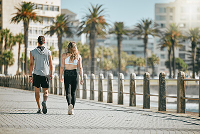 Buy stock photo Fitness, teamwork or mockup with a runner couple on the promenade for cardio or endurance from the back. Exercise, wellness or workout with a man and woman athlete running outdoor in the city