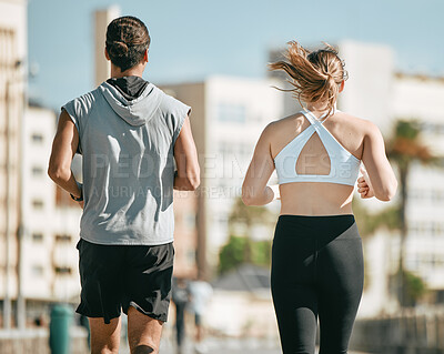 Buy stock photo Couple, fitness and running back together in the city for exercise, workout or cardio routine in Cape Town. Active man and woman runner taking a walk or jog for healthy wellness or exercising outside