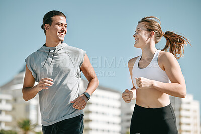 Buy stock photo Couple, fitness and smile running in the city for exercise, workout or cardio routine together in Cape Town. Happy man and woman runner taking a walk or jog for healthy wellness or exercising outside