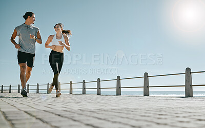 Buy stock photo Couple, fitness and running by beach on mockup for exercise, workout or cardio routine together. Happy man and woman runner taking a walk or jog for healthy wellness or exercising in Cape Town