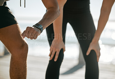 Buy stock photo Running couple, time and smartwatch with fitness and check heart rate with cardio and outdoor workout. Legs, hands and cardiology with runner black man and woman, exercise and wellness with run break