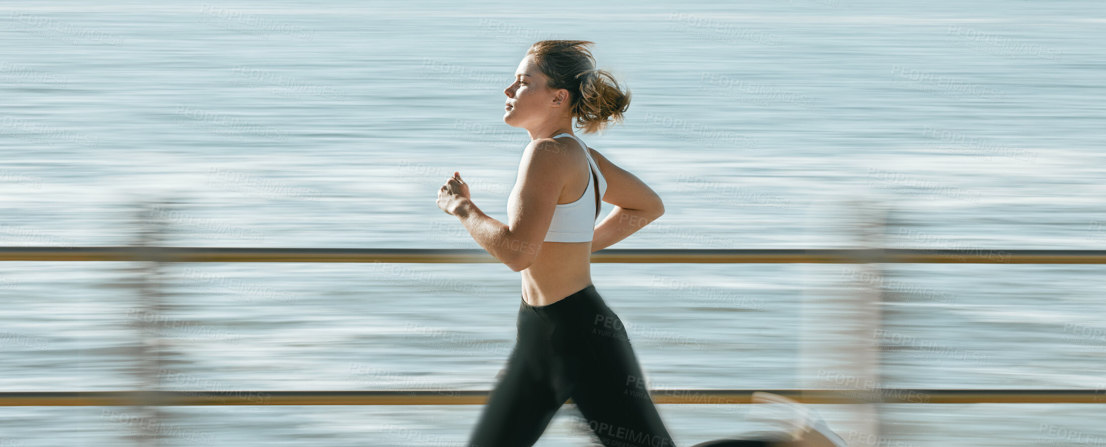 Buy stock photo Woman, fitness and speed running by beach on mockup for exercise, workout or cardio routine. Active female runner in fast run, sprint or race by the ocean coast for healthy exercising or wellness