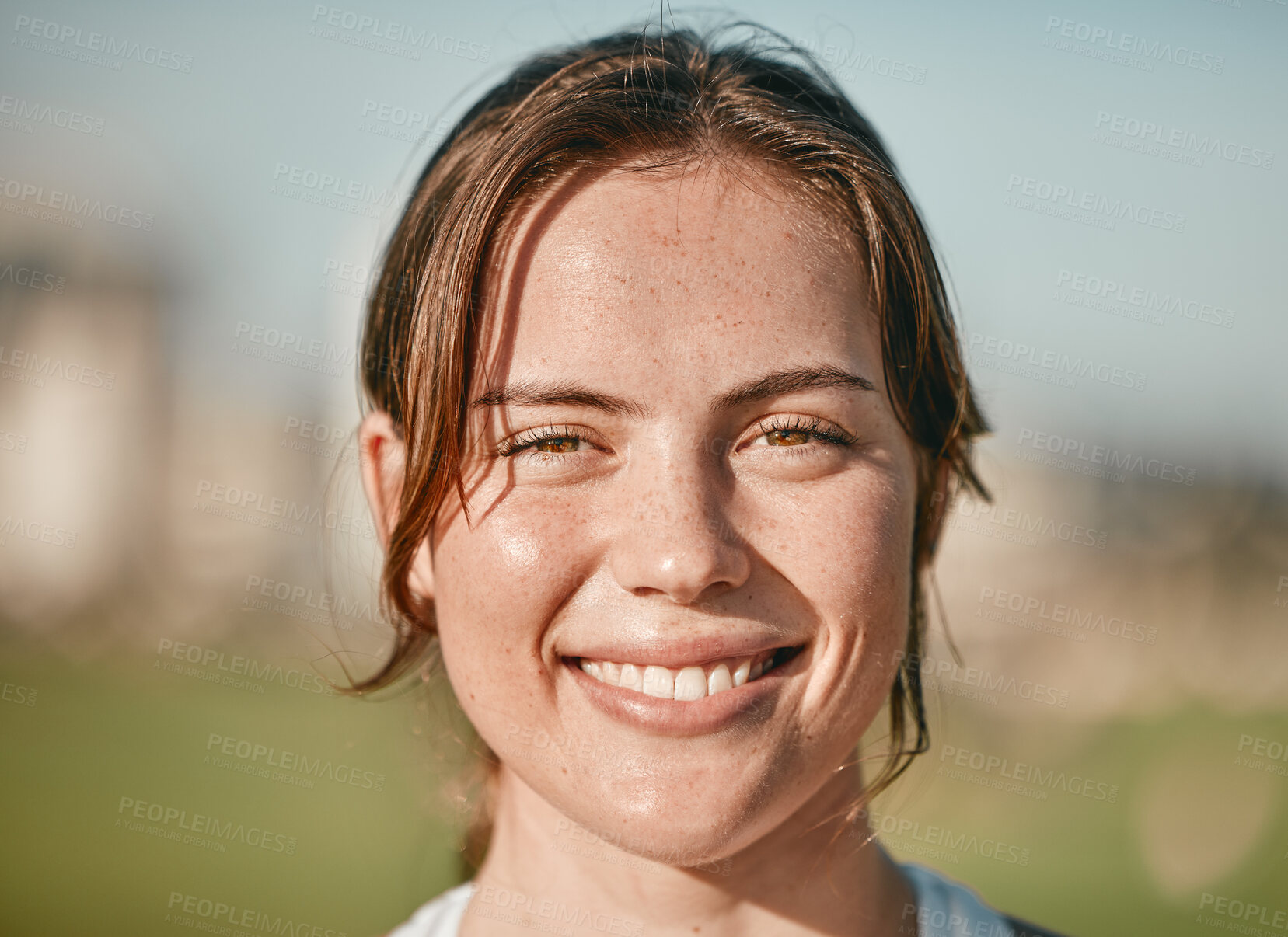 Buy stock photo Portrait, happy and smile with a woman outdoor on a bokeh green background for carefree positivity. Face, wellness and zoom with an attractive young female standing outside on a summer day in nature