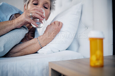 Buy stock photo Sick, mature and woman drinking water with medicine for pain, virus or insomnia in bed. Healthcare, flu and elderly person in the bedroom for sleep with pills for an illness, infection or cold