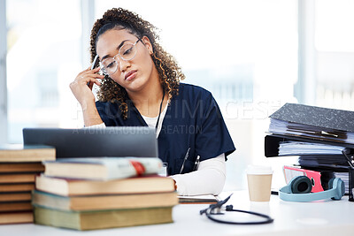 Buy stock photo Nurse, tired or stress in hospital education, wellness books study or research laptop learning in medicine scholarship. Thinking, woman or burnout for healthcare worker, student or anxiety internship