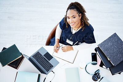 Buy stock photo Top view, portrait or nurse on hospital laptop research, education woman studying or books learning for medical student. Above, smile or happy doctor on healthcare technology in medicine internship