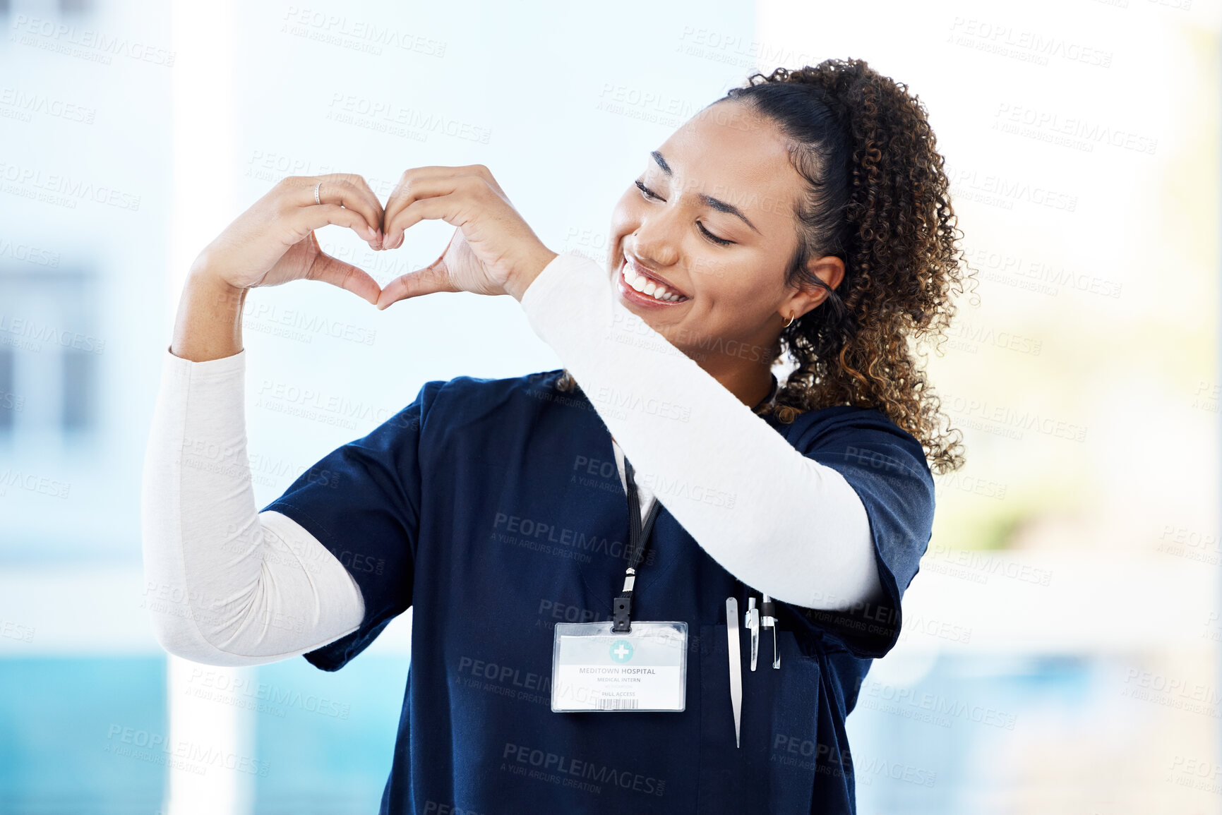 Buy stock photo Doctor, volunteer or heart hands in hospital wellness, medicine trust or medical support in life insurance, help or vote. Smile, happy or nurse and love gesture in healthcare, emoji or woman security