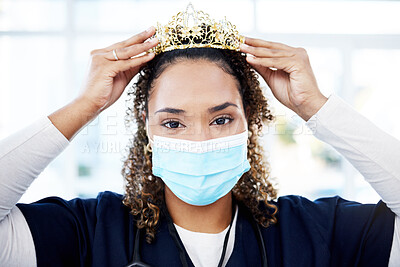 Buy stock photo Crown, award and portrait of a doctor with a face mask for celebration, achievement and promotion. Success, winner and female nurse with a gift as motivation for nursing and healthcare with covid