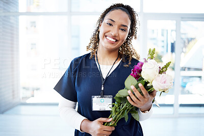 Buy stock photo Success, celebration and portrait of doctor with flowers at a hospital for promotion and gift for work. Care, happy and female nurse with bouquet as a present for commitment in healthcare nursing job
