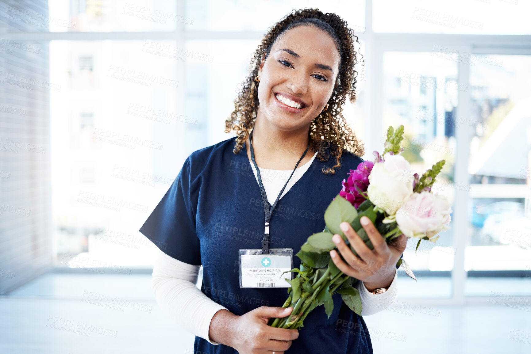 Buy stock photo Success, celebration and portrait of doctor with flowers at a hospital for promotion and gift for work. Care, happy and female nurse with bouquet as a present for commitment in healthcare nursing job