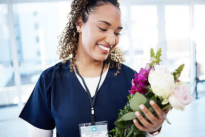Buy stock photo Achievement, celebration and a doctor with flowers at a hospital for a promotion and gift for work. Care, happy and female nurse with a bouquet as a present for promotion in healthcare nursing job