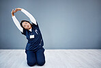Tired nurse, stretching or arms up on hospital mockup, clinic backdrop or wall mock up in wellness mobility, joint support or healthcare. Doctor, woman or medical physiotherapist and hands in warm up