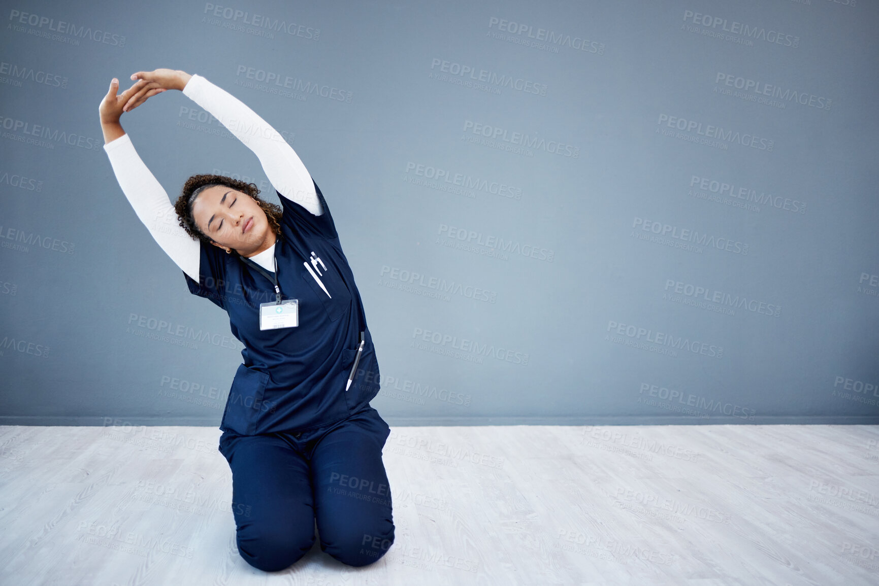 Buy stock photo Tired nurse, stretching or arms up on hospital mockup, clinic backdrop or wall mock up in wellness mobility, joint support or healthcare. Doctor, woman or medical physiotherapist and hands in warm up