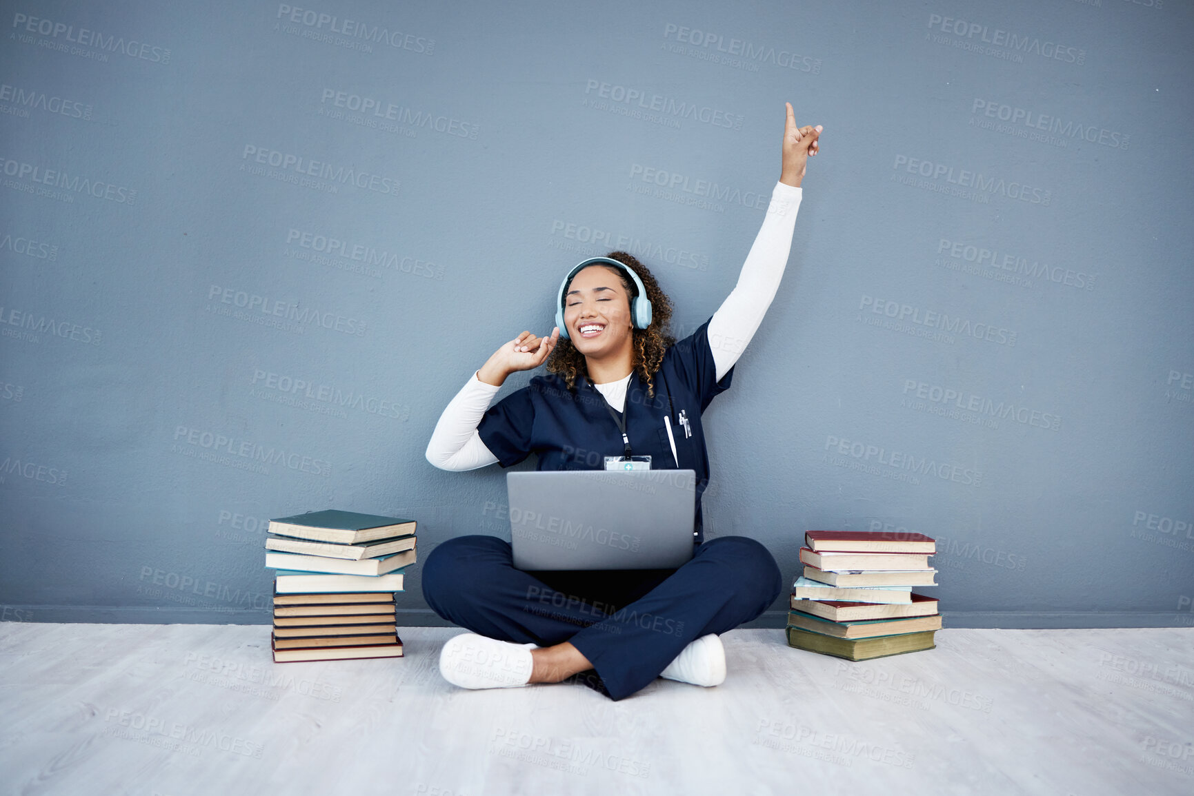 Buy stock photo Doctor, laptop or headphones dance to hospital music, podcast or radio in woman study research or mock up learning. Smile, happy or dancing medical student on healthcare technology for books success