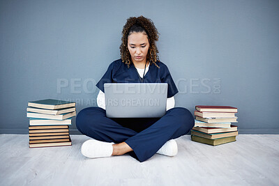 Buy stock photo Nurse, laptop or typing in hospital research, wellness books study or education in medicine scholarship on mockup wall. Medical student, woman or healthcare technology for worker research internship