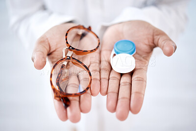 Buy stock photo Eye care, choice with glasses or contact lenses in hands, closeup and vision with healthcare for eyes. Prescription lens, person with frame and plastic container, optometry with optician and health