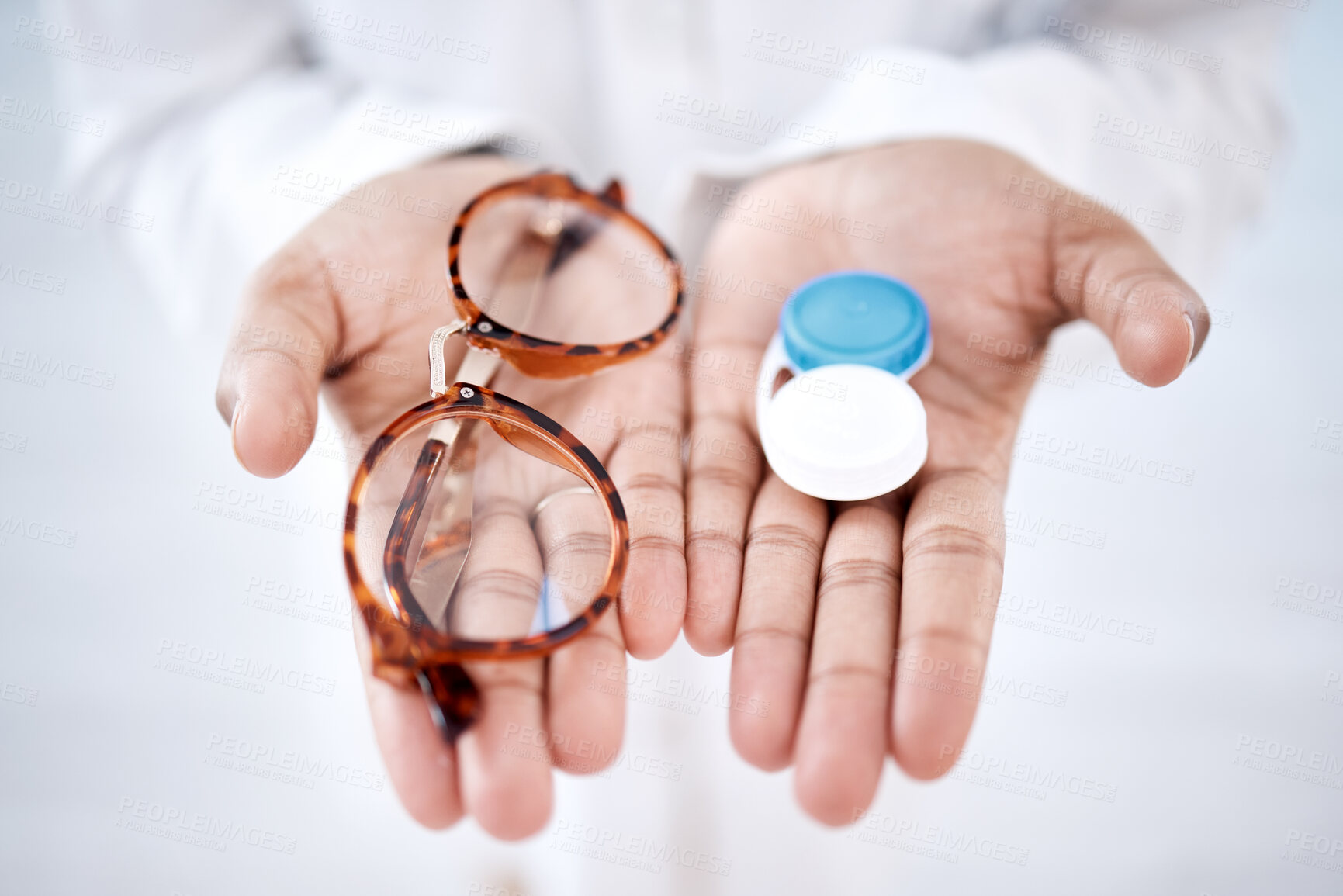 Buy stock photo Eye care, choice with glasses or contact lenses in hands, closeup and vision with healthcare for eyes. Prescription lens, person with frame and plastic container, optometry with optician and health