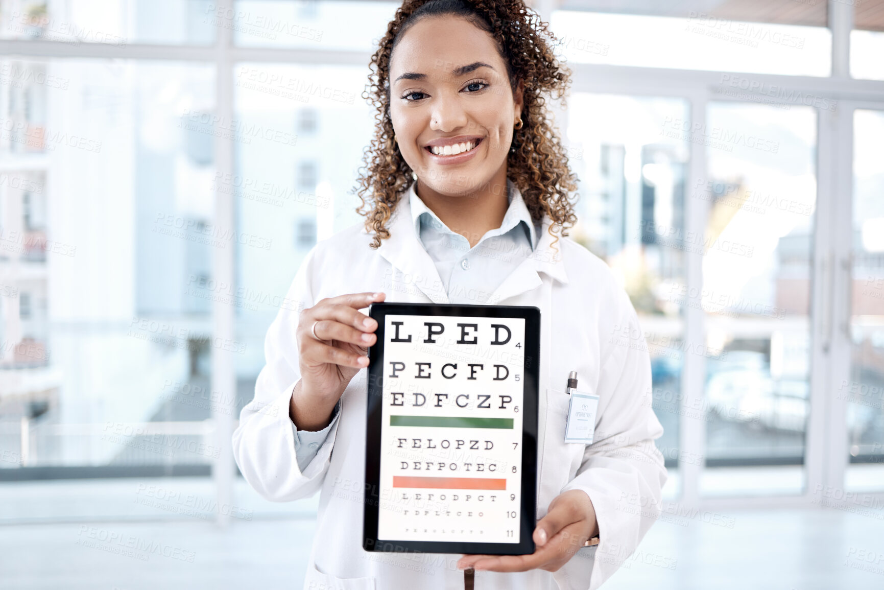 Buy stock photo Portrait, eye chart and doctor with tablet in hospital for vision examination in clinic. Healthcare, snellen and medical ophthalmologist or woman holding technology with text or letters for eyes test