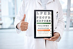 Hands thumbs up, tablet screen and eye chart in hospital for vision examination in clinic. Healthcare, snellen technology or woman, optometrist or doctor with thumbsup emoji and letters for eyes test