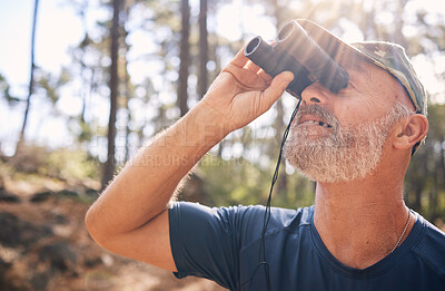 Buy stock photo Binoculars, senior man and hiking in nature looking at view, sightseeing or watching. Binocular face, adventure search and elderly male with field glasses, trekking or exploring on vacation outdoors.