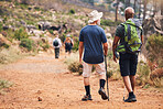 Hiking, fitness and people walking on mountain for adventure, freedom and fitness in outdoor forest. Travel, retirement and senior hikers for exercise wellness, trekking and cardio workout in nature