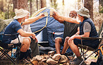 Man, friends and camping with cheers to drink in nature for travel, adventure or summer getaway on chairs by tent in forest. Group of men relaxing or drinking in celebration for outdoor camp together