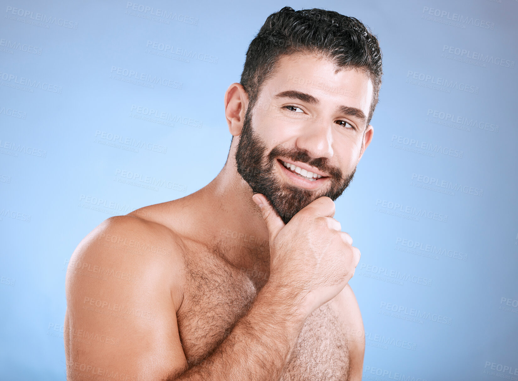 Buy stock photo Idea, beauty and natural with a man model in studio on a blue background for skincare, wellness or grooming. Face, beard and skin with a handsome young male thinking about cosmetics or treatment