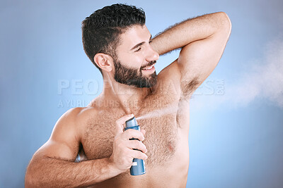 Buy stock photo Deodorant, spray and man in studio for hygiene, fresh scent or underarm perfume. Male model spraying armpit for body odor, smell and cleaning cosmetics, shower product and skincare mist on background