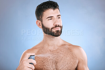 Buy stock photo Deodorant, body spray and man in studio for hygiene, fresh scent and sweating perfume. Male model spraying odor cosmetics, fragrance and cleaning skincare of beauty mist, shower product or background