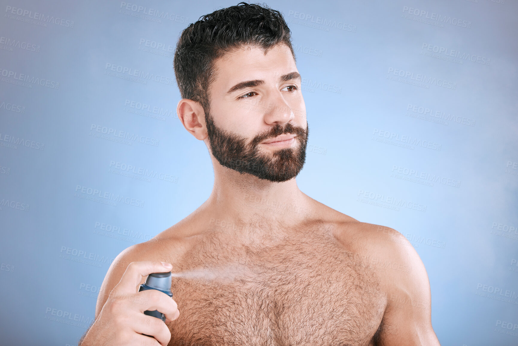 Buy stock photo Deodorant, body spray and man in studio for hygiene, fresh scent and sweating perfume. Male model spraying odor cosmetics, fragrance and cleaning skincare of beauty mist, shower product or background