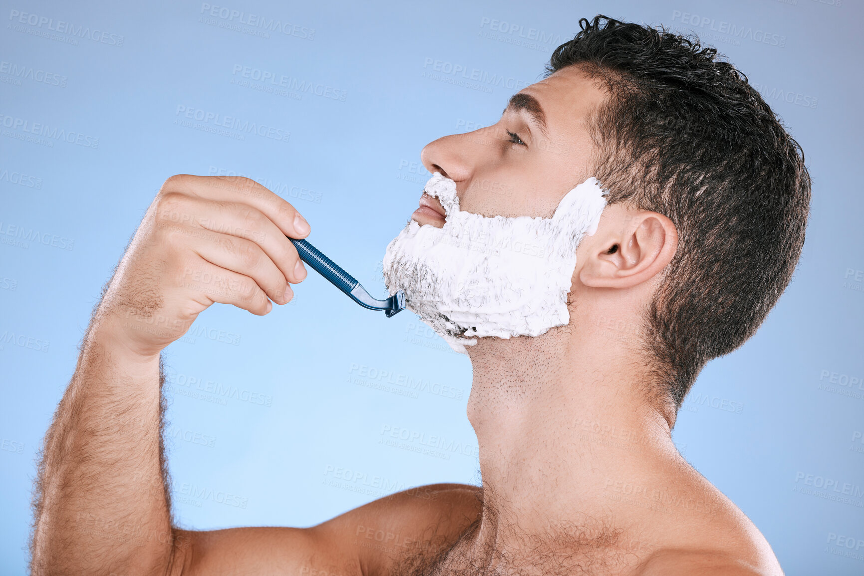 Buy stock photo Shaving chin, foam and man with razor, beard maintenance and product placement in studio mock up. Shave cream, face and hair or skincare for male model facial grooming, isolated on blue background.