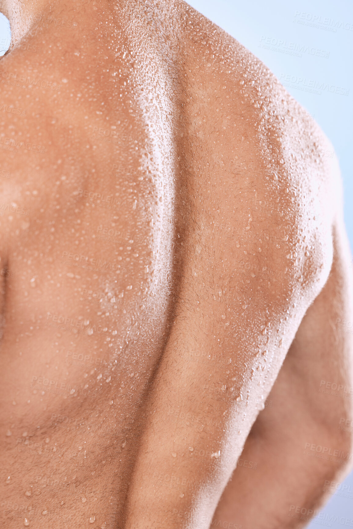 Buy stock photo Man, back and water drops for shower on background of skincare, hygiene and healthy dermatology. Closeup behind torso, strong male and wet human body with muscle, anatomy cleaning and studio wellness