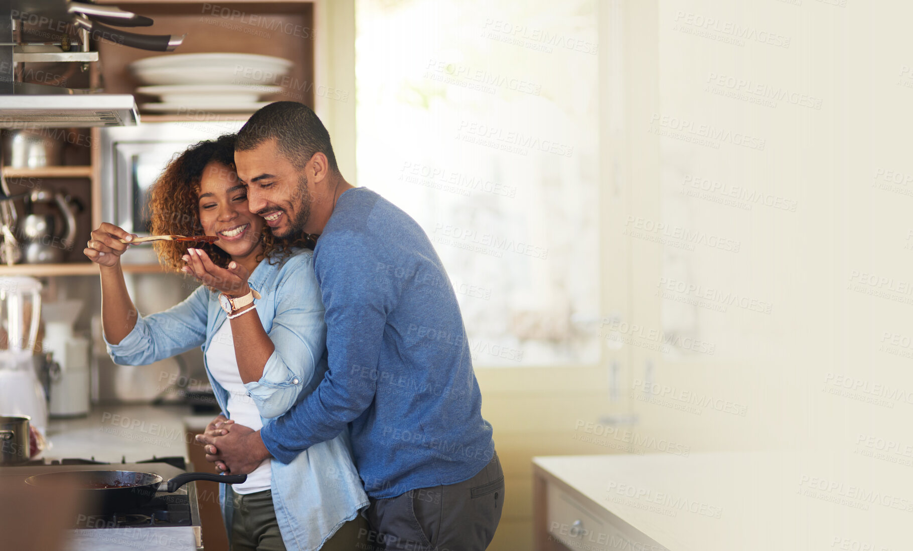 Buy stock photo Cooking, black couple and hug in a kitchen with marriage and love at home with mockup. Dinner, food taste and happy woman and man together with care in a house with mock up and happiness from eating 