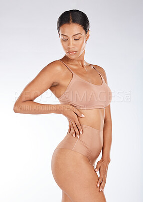 Black woman, slim body and underwear in fitness, healthy diet or weight  loss against a gray studio background. Young African American female model  in sexy lingerie, wellness lifestyle or beauty