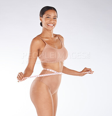 Buy stock photo Diet, portrait or stomach of happy woman with tape measure to track weight loss transformation, fitness or body goals. Tummy tuck progress, health wellness or self care girl check liposuction results