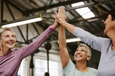 Buy stock photo Teamwork, fitness and high five of senior women in gym celebrating workout goals. Sports targets, celebrate and group of friends with hands together for success, motivation and exercise achievements.