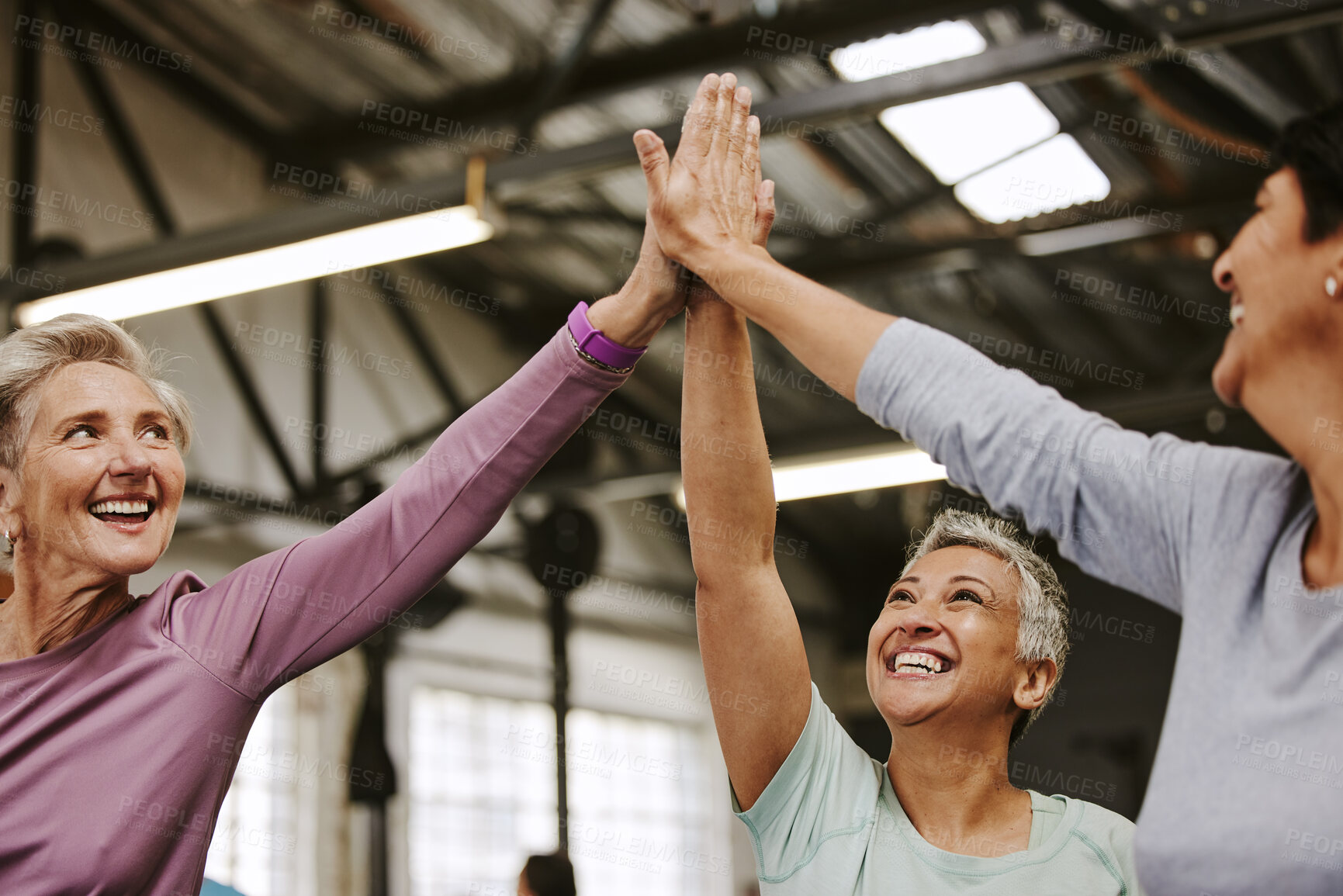 Buy stock photo Teamwork, fitness and high five of senior women in gym celebrating workout goals. Sports targets, celebrate and group of friends with hands together for success, motivation and exercise achievements.