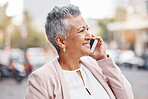 Senior woman, phone call and smile in the city streets for communication, conversation or discussion. Happy elderly female smiling on smartphone for 5G connection, talking or networking in urban town