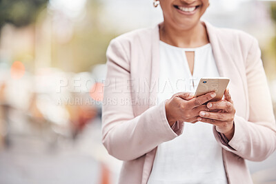 Buy stock photo Woman, hands and phone in city for social media, communication or chatting and texting. Hand of female with smile on smartphone for 5G connection, talking or networking in road of an urban town